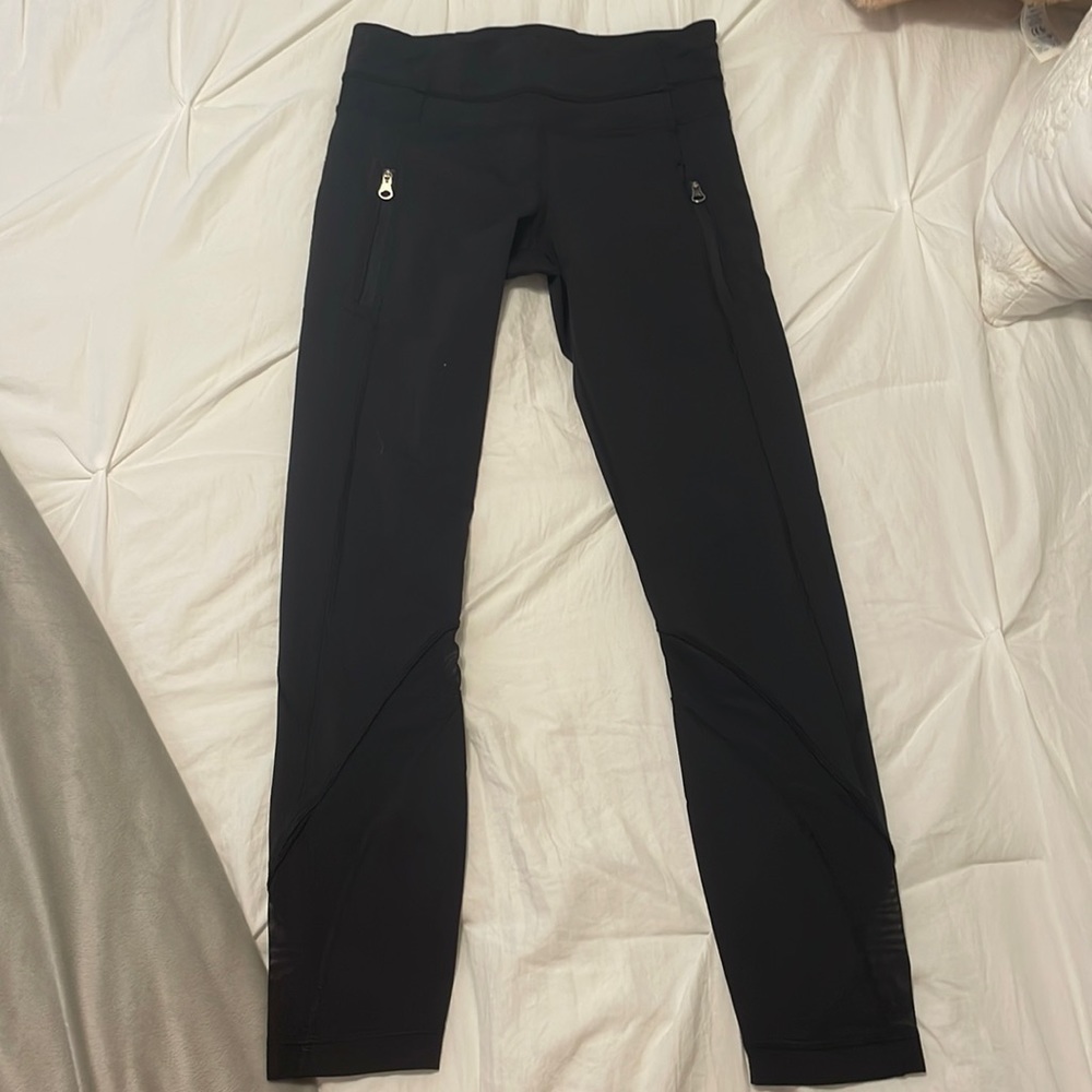 lululemon leggings, size 4, zipper pockets, mesh on the legs, go to mid waist